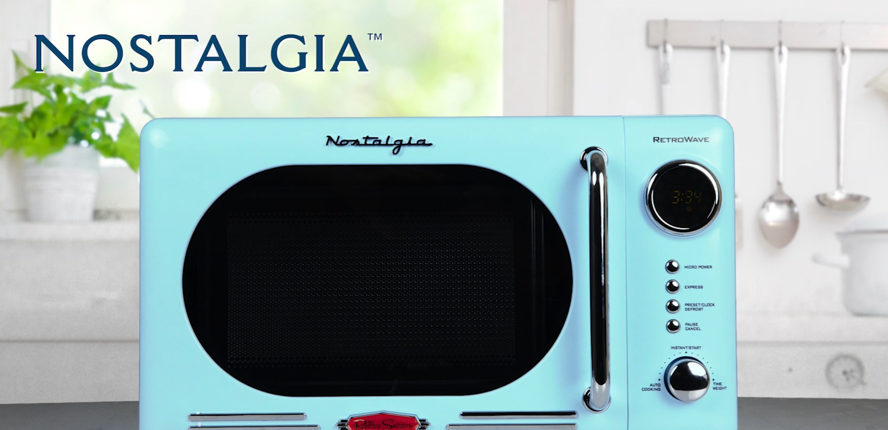 thumbnail video image 2 of Nostalgia 0.7 cu ft Retro Microwave Oven, 700W Countertop Microwave Oven with Digital Clock, Aqua, 2 of 7